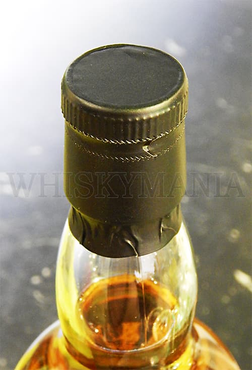 Оформление нижней части бутылки шотландского виски Килкерран