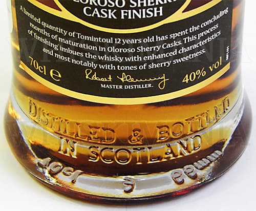 Оформление нижней части бутылки шотландского виски Tomintoul